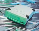 Ecrix VXA-1 external tape drive - it may look green but it's white with a coloured light on it.